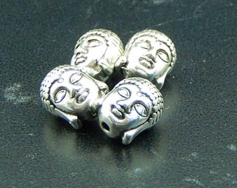 5 Buddha head beads