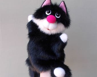 Big black cat. Bibabo. Toy glove. Puppet theatre. Marionette. Toy on hand.