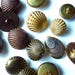 Lot of different buttons look shell or clam. Sizes and various sets, metal or resin.