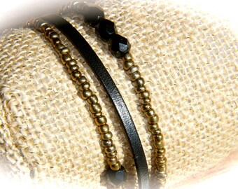 LEATHER STRAP AND BLACK BEADS AND GOLD