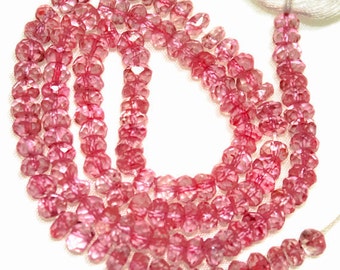 Pink luster-coated topaz faceted rondelles. Approx 4mm. Select a strand length