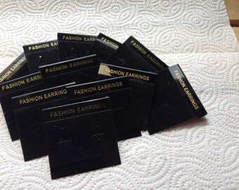 Two dozen black flocked earring cards