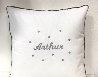 White pillow embroidered name and stars