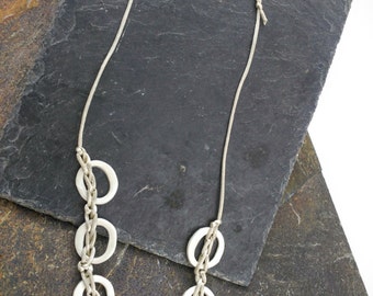 Necklace of porcelain and thread