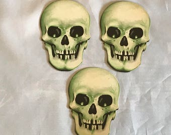 Lot of three vintage Halloween cardboard die cut skull skeleton