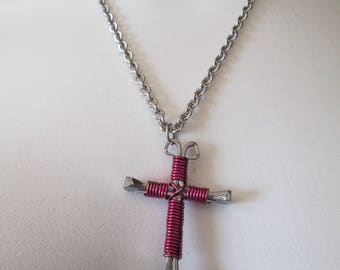 Handcrafted religious cross made from horseshoe nails wrapped with magenta wire pendant necklace