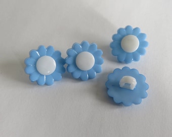 White and blue flower shaped button