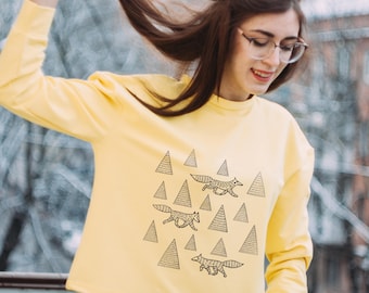 Yellow sweatshirt with prints "wolves in the forest"