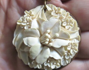 Vintage Celluloid Floral Pendant with Pearl and Brass beads.