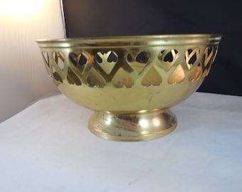 Vintage brass bowl with heart shapes taken out around the edge.