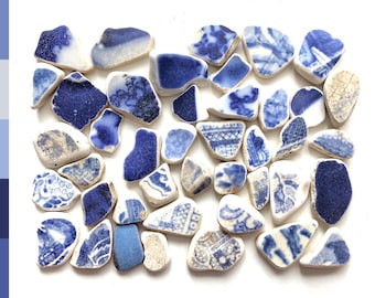 Sea pottery pieces, small blue and white beach pottery shards, washed up on the Edinburgh beach 0042