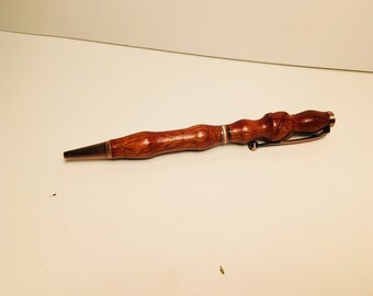 Handmade Blood wood pen with carved knot