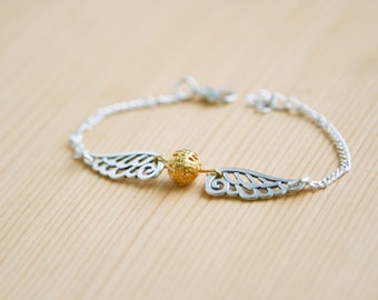 Winged golden snitch bracelet Harry Potter fan souvenir gift idea wings ball