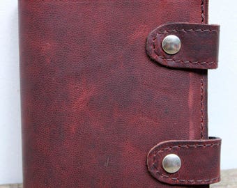 Book old, weathered brown leather wallet vintage