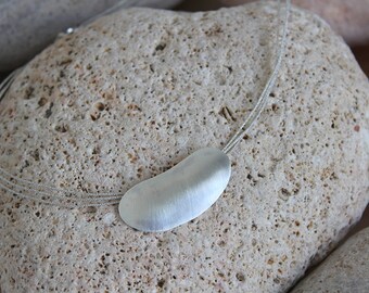 Pendant in sterling silver simulating a pebble beach or pebble. Mediterranean Collection