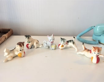 5 vintage porcelain cats playing ball