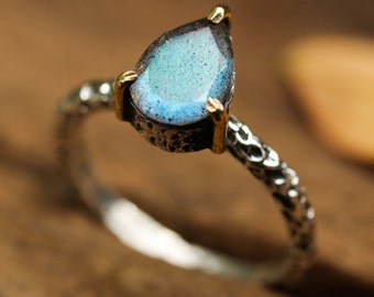 Labradorite teardrop ring in silver bezel and brass prongs setting with sterling silver oxidized texture band