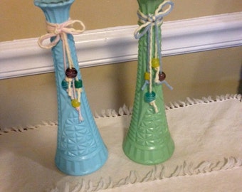 Two glass painted bud vases green and blue