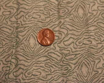 23 Green cotton with a swirly pattern