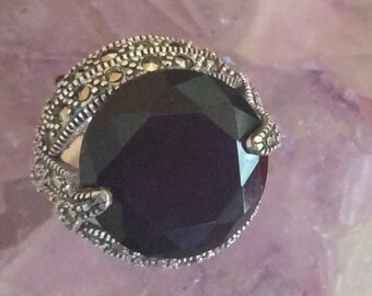 Sterling silver ring and stimulated blue gem