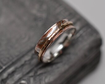 Narrow gold-filled and mokume gane spinner ring argentium silver copper