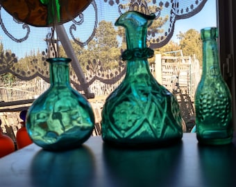 Three Blue-Green Vintage Bottles