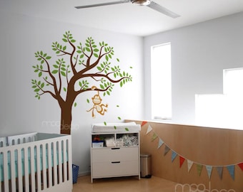Cute Little Monkey Swinging on tree branch having fun wall decal nursery and playroom sticker