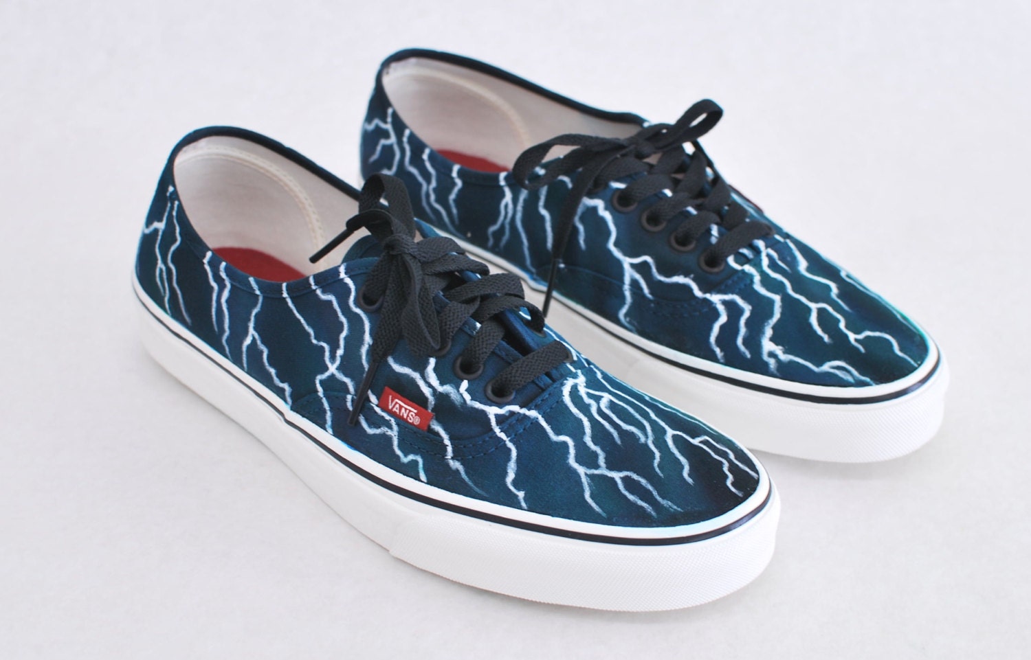 black vans with lightning bolt