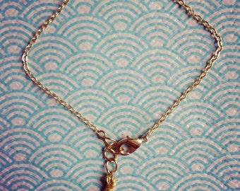 Bracelet gold sequined yoke and Pompom
