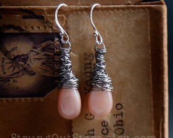 Strung-Out guitar string earrings with peach moonstone