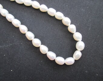 Oval cultured white pearls smooth 8 mm * 6 mm * 1 set of 10
