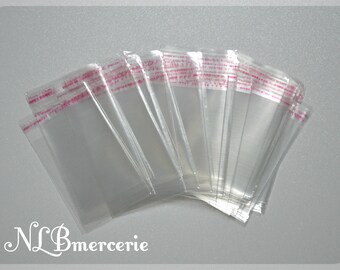 Transparent adhesive plastic bags sold in packs of 50