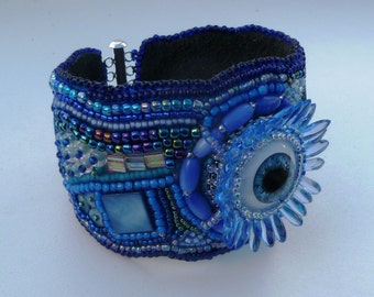 Blue ‘eye’ and scarab beaded cuff.