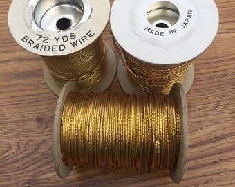 Wire. NOS. Vintage Braided wire. Metalic gold. Sold by Yard or spool.