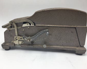 Vintage industrial paper tape dispenser. Industrial decor. Industrial door stop, industrial book end. Office equipment, industrial metal