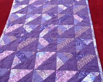 23x17 baby doll quilt. Shades of purple brighten this little patchwork doll quilt.