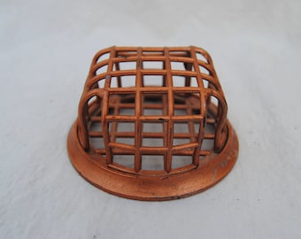 Cage style flower frog copper colored