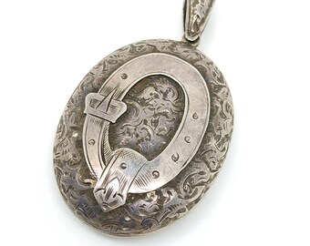 Large Victorian Sterling Silver Locket with Garter Belt Motif and Hand Engraving.