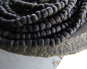 black glass seed bead, small rustic matte tone, irregular spacer barrel tube, New Indo-pacific indonesia 3 to 5mm ( 22 in strd ) 7ab65-5