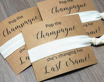 Pop the Champagne She's Changing Her Last Name Hair Tie Favors | Bachelorette Party Favors | Bachelorette Hair Ties | Bridesmaid Favors