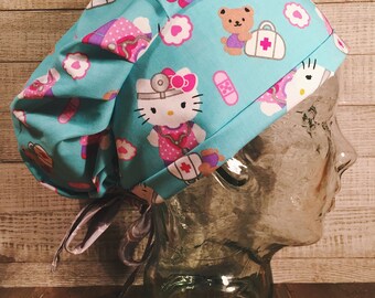 Doctor Nurse Hello Kitty Women's Surgical Hat Scrub Cap in light aqua blue fabric with pleats and pink grey damask ties
