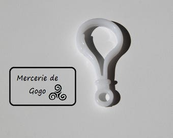 Hook or hook for white baby toy.