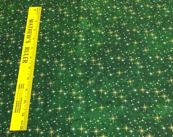 Reindeer Prance-Gold Stars on Green Cotton Fabric Designed by Deborah Edwards for Northcott Studios