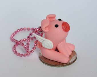 Pierce the polymer clay winged pig charm