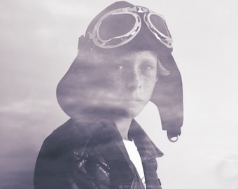 Fine Art Composited Print "Flights of Fancy" of a boy immersed in his dreaming of aviation