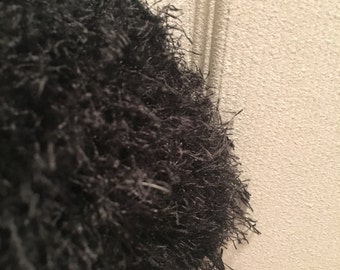 Black fuzzy knitted scarf