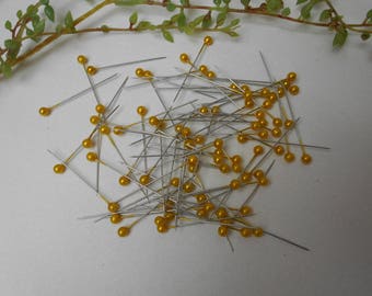 80 pins with yellow beads