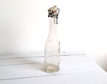 Great old glass bottle with porcelain stopper 'Herman Glock'