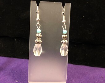 Clear /silver toned/blue drop earrings.