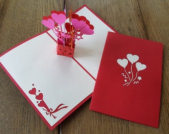 Tarjeta pop-up de corazón globos